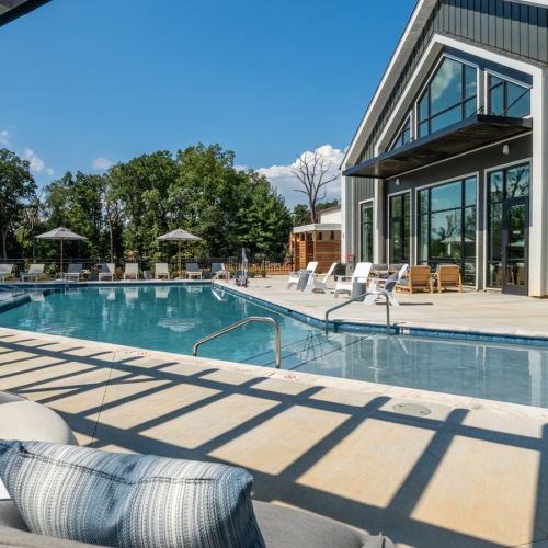 Adventure around every corner. Pool side lounge chairs, exterior of clubhouse and outdoor showers