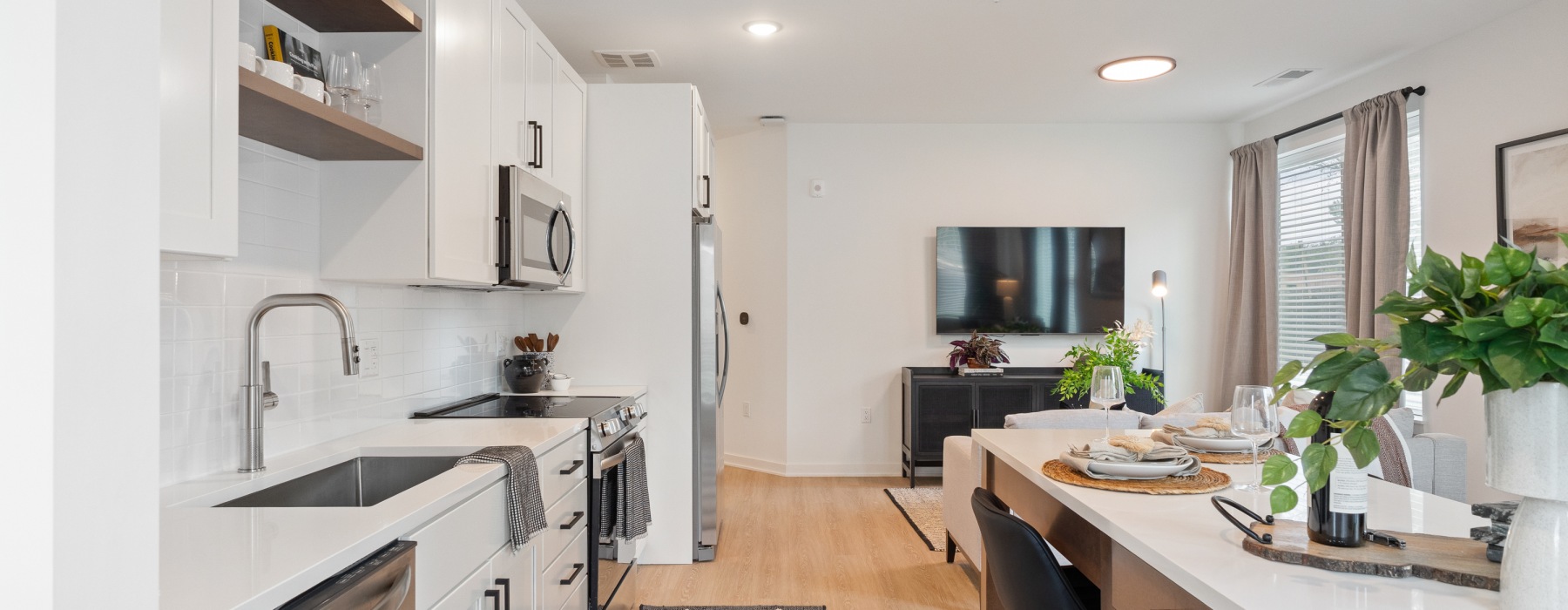 open concept kitchen with white cabinets