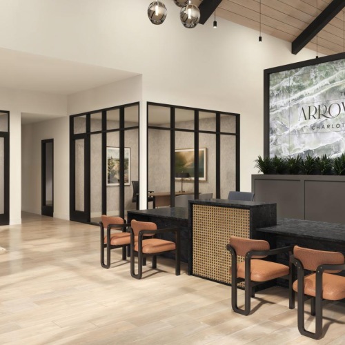 a room with a large television and chairs